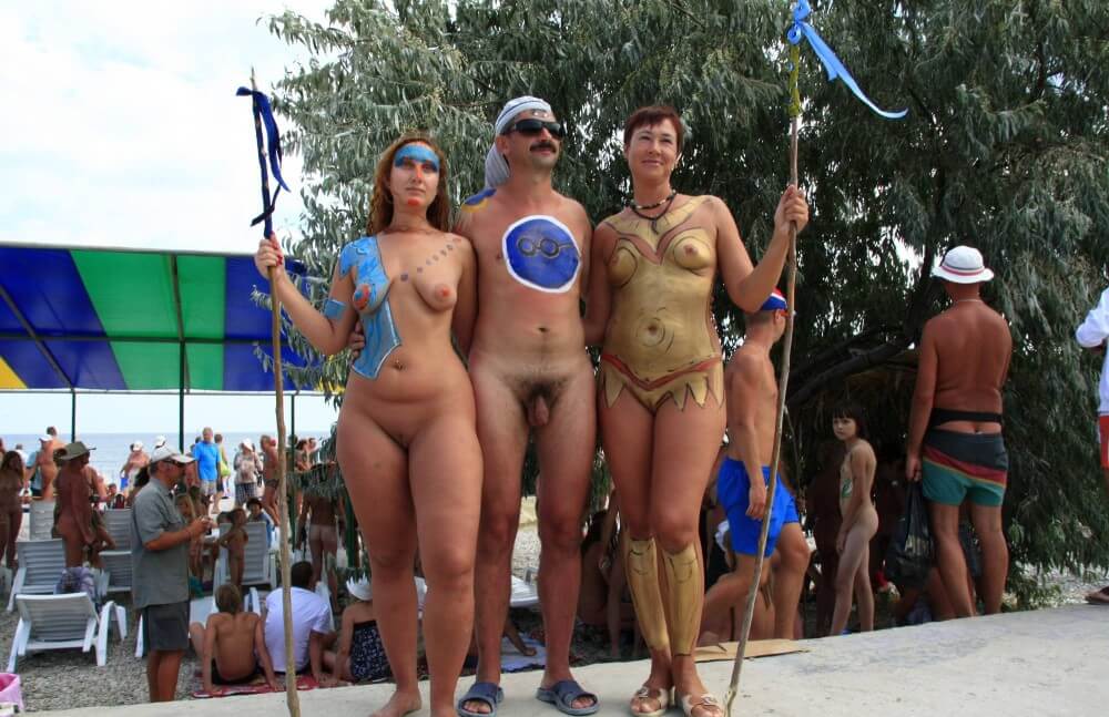 Three Painted Girl Poses pics - A nudist values trust and friendliness among people