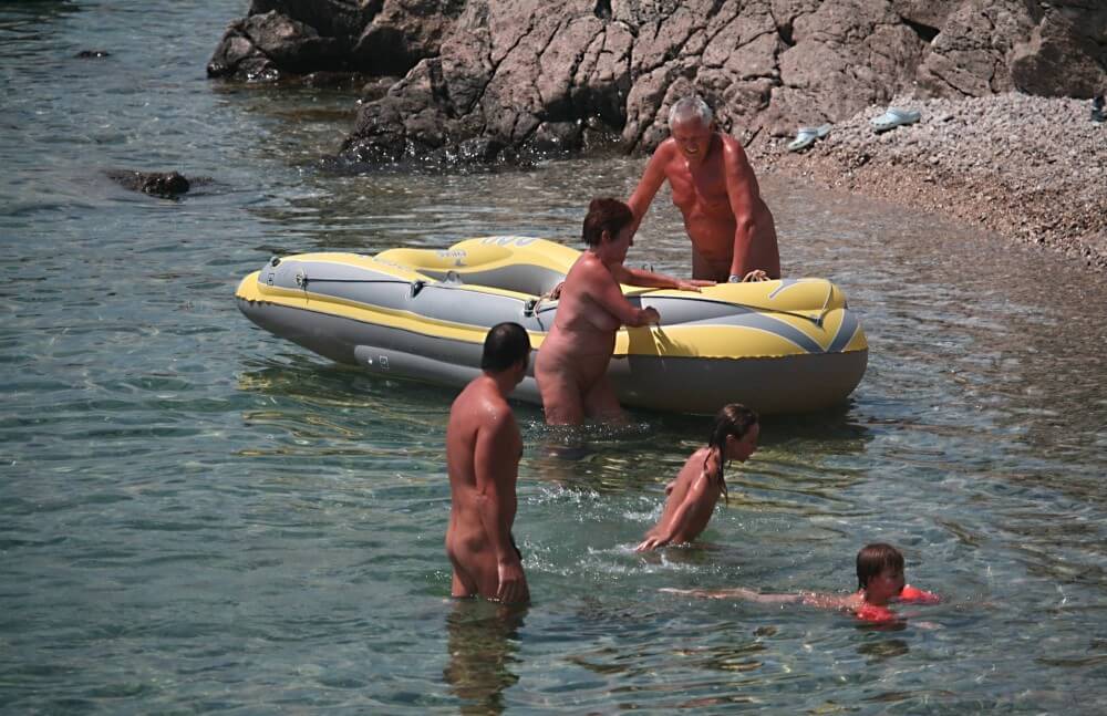 Lone Nudist in Yellow Boat photos - Nudity helps you understand yourself and the people around you better