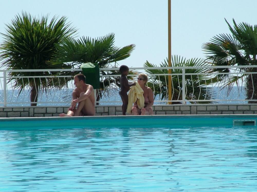 Photo of naturists in an outdoor pool - Ideological Supporters of the Movement