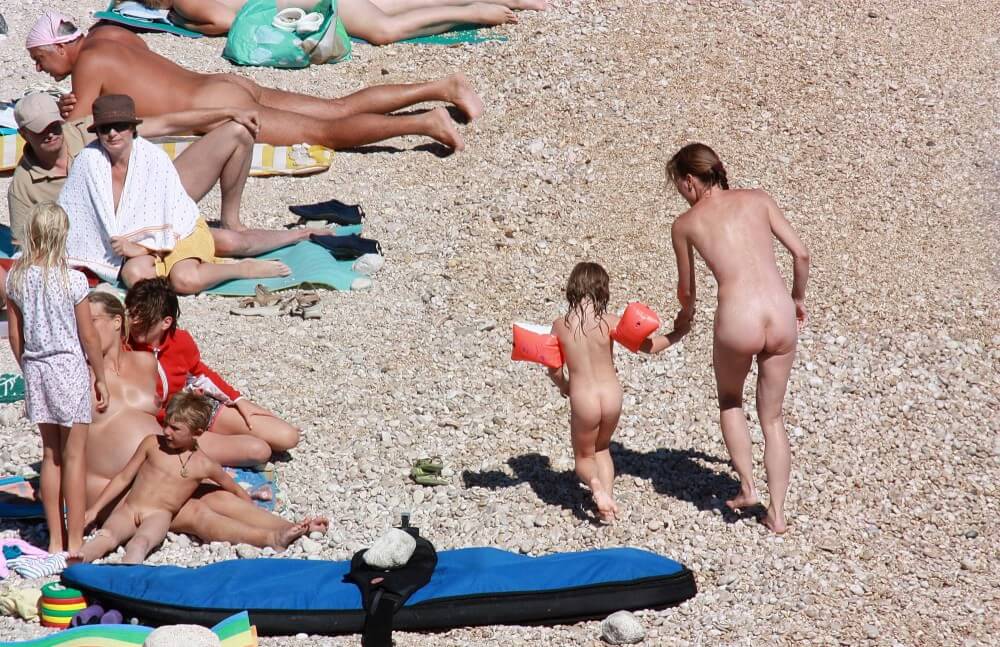 Orange Floaty Safety First Naturist pics - Types of recreation in nudist destinations